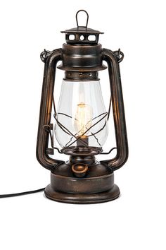 an old fashioned lamp with a light bulb on it