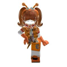 an orange and white figurine with glasses on it's head, holding a cat