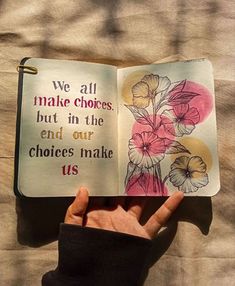 someone is holding up an open book with flowers on it and the words we all make choices, but in the end our choices make us