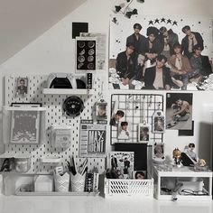 the wall is covered with many pictures and magnets on it's sides as well as several other items