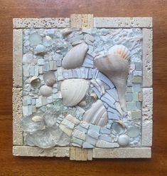 Peaceful white on white mosaic artwork 9.5" x 9.75". Glass, shell, marble, stone, and ceramic bits pulled together as if swept across the canvas by a strong ocean wave. All these elements are securely adhered by white mortar. The backside has a D-ring screwed into place for hanging. The frame is coated with a sealer. The shells are authentic. A spray of color on the pecten is peeping out from under the conch shell. Glued to the back of the artwork is a vintage sheet of music as a personal touch. Mosaic With Shells, Shells Wall Art, Mosaic Inspiration, Shell Mosaic, Mosaic Tile Art, White Mosaic, Mosaic Artwork, White On White, Vintage Sheets