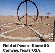 an image of a peace sign in the middle of nowhere with text overlay that reads field of peace route 66 - conwy, texas, usa