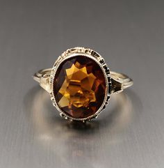 Beautiful 1950s vintage silver citrine ring, US Size 7, in good vintage condition. Box on the photos not included! Diameter: approx. 20 mm (0.7 inch) Material: 925 silver (gold plated), citrine total weight: 3.2 g US Size: approx. 7 (EU size 55) A stunning religious shop well worth a visit ... https://etsy.me/2NNNK4g Collectible Vintage Sapphire Ring, Classic Orange Topaz Ring For Anniversary, Heirloom Amber Rings For Formal Occasions, Antique Sapphire Birthstone Ring For Formal Occasions, Classic Amber Rings For Formal Occasions, Vintage Topaz Promise Ring, Formal Amber Ring With Prong Setting, Antique Oval Birthstone Ring For Formal Occasions, Vintage Sapphire Ring For Anniversary