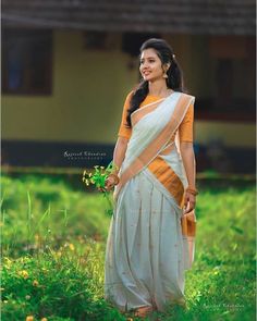 It consist of three pieces, skirt, blouse and halfsaree/ neriyathu. Fabric and Work: Skirt: The skirt is made of ivory color half fine Kerala handloom with gold boarder. The skirt is lined with a soft cotton fabric. The skirt has small scattered gold flowers. It looks likes stars sparkle in the sky. Blouse: The fabric used for blouse is pure quality  rawsilk and is lined with cotton fabric. It has small golden flowers on the sleeve. The blouse hook opening at the back side. The blouse color can Kerala Half Saree, Kasavu Saree, Sarees For Girls, Half Saree Lehenga, Set Saree