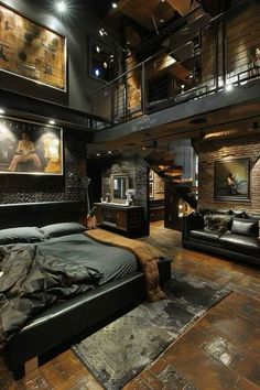 a bedroom with black leather furniture and pictures on the wall