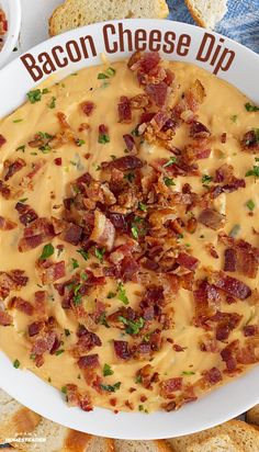 bacon cheese dip in a white bowl surrounded by crackers