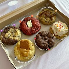 a box filled with different types of cookies