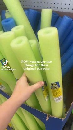 a person is pointing at some neon colored plastic tubes in a store display case, with the caption pov you never use original purpose