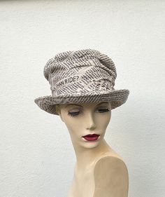 Fabulous newspaper print ruched top hat, cotton furnishing fabric made into top hat. Handmade stylish fabric top hat. *Front crown is 13cms/5.2 inches tall. *Size M/L to fit head size 58cms/22.83inches *Dry clean or spot clean To see more of my hats please click https://www.etsy.com/uk/shop/OverToYou I design, pattern cut and create all my hats in sunny Brighton in the South of England. All my designs are original and combine timeless elegance with a modern twist. I despatch my hats using Royal Mail 1st class post within the U.K. and International Tracked and Signed outside the U.K. Thank you for visiting my shop Luxury Artisan Adjustable Top Hat, Luxury White Adjustable Top Hat, Handmade Adjustable Vintage Top Hat, Vintage Black Handmade Top Hat, Steampunk 4" Top Hat, Furnishing Fabric, South Of England, Newspaper Print, Newspaper Printing