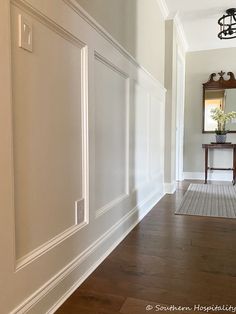 the hallway is clean and ready to be used as a home decorating area for guests