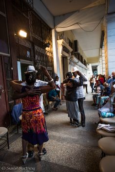 a group of people standing around each other