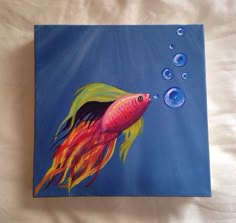 an acrylic painting of a fish with bubbles