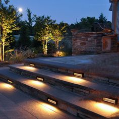 some steps lit up with lights in the evening