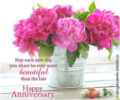 pink flowers in a silver vase with happy anniversary message on the front and back side