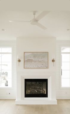 an empty living room with white walls and wood floors