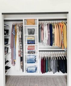 an organized closet with clothes and shoes