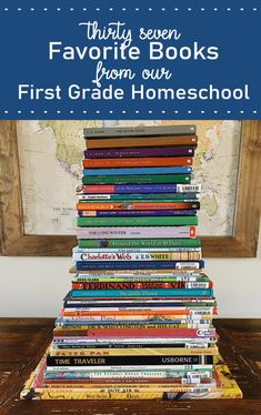 a stack of books sitting on top of a wooden table