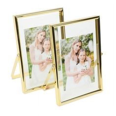 two gold frames with photos on them, one is holding a baby and the other is holding an adult