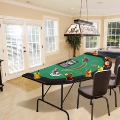 a dining room with a pool table and chairs