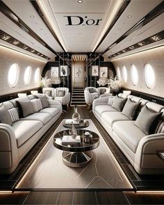 the inside of an airplane with couches and tables