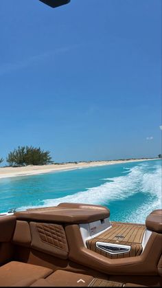 the inside of a motor boat with water in the background