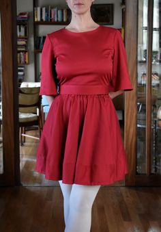 This is a 100% cotton full skirt with elaticated waist in red. The skirt is made out of a beautiful high quality cotton sateen - this fabric has a suble sheen giving it a luxurious look. The fabric is thick, soft and has a little bit of stretch to it making it very comfortable to wear. This is a versatile garment as the skirt can be easily dressed up with a top or worn with a jumper for a more casual look. The lenght of the skirt is approximately 44cm (17''). Shown here with the red cotton sateen full circle skirt.  This item here is in size S and the model's height is 165cm (5′4″).  If you would the to lenghten or shorten the hem please let me know - it is easy to do to! Available sizes (see size chart in photos): XXS, XS, S, M, L, XL, XXL.  Current production time is up to 2 weeks. Red Flared Cotton Skirt, Red Cotton Flared Skirt, Red Pleated Dress With Relaxed Skirt, Red Dresses With Pleated Relaxed Skirt, Red Dress With Relaxed Flared Skirt, Red Flared Dress With Relaxed Skirt, Stretch Red Skirt With Elastic Waistband, Cotton Lined Mini Skirt Dress, Cotton Mini Dress With Gathered Skirt