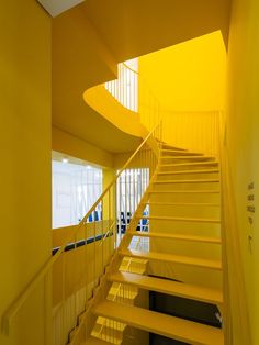 a yellow staircase in an office building