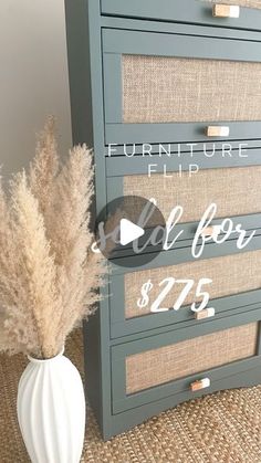 a white vase sitting next to a gray dresser with a sign that says furniture flip sale $ 75