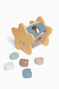 a wooden toy with several different shapes and colors