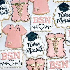 decorated cookies are arranged in the shape of nurse's shirts and gowns with caps on them