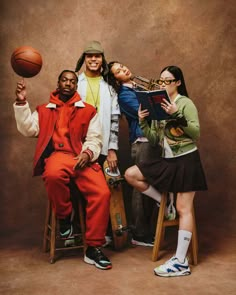 three people are posing for a photo with a basketball ball in front of their faces