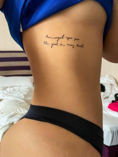 the back of a woman's stomach with writing on it