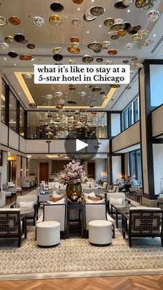 a hotel lobby with chandeliers and chairs on the ceiling is featured in this ad