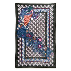 a decorative wall hanging with a blue and red peacock on it's left side