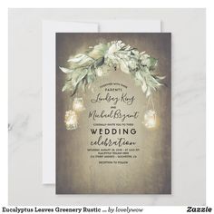 an elegant wedding card with mason jars and greenery