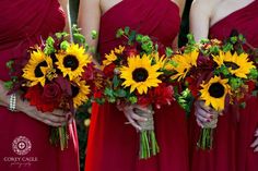 the bridesmaids are wearing red dresses with sunflower bouquets