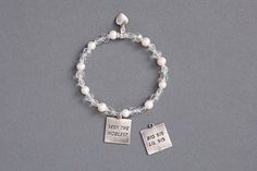 This is a great gift for your Big or Little Sis!  The reversible charm says "Seek the Noblest" on front and "Big Sis Lil Sis" on the back!  $24.99 Crystal Beads Bracelet, Bead Bracelet, Charm Bracelets