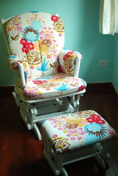 a child's rocking chair and foot stool in a room