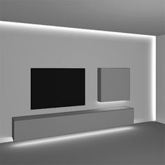 an empty room with a flat screen tv mounted on the wall and illuminated by lights