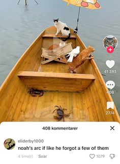 two cats are sitting in a boat with an umbrella over it and another cat is standing on the back