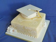 a cake with a graduation cap and tassel on top