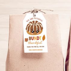 a brown paper bag with a tag that says, we are not giving bundt beautiful thank you for all you do