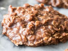 chocolate cookies with nuts are sitting on a table