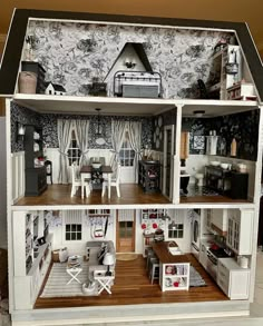 a doll house with furniture and accessories in it