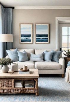 a living room filled with lots of furniture and pillows on top of a table in front of a window