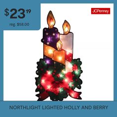 a lighted candle with holly wreaths and lights on it for $ 23 99 reg $ 58 00