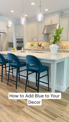 a kitchen island with blue chairs in it and the words how to add blue to your decor