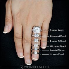 a woman's hand with four different engagement rings on her fingers and measurements for each ring