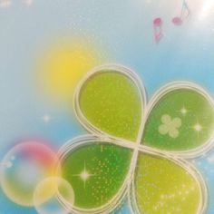 an image of a four leaf clover with music notes in the background