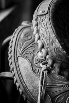 the back end of an old chair with a hat on it's headrest